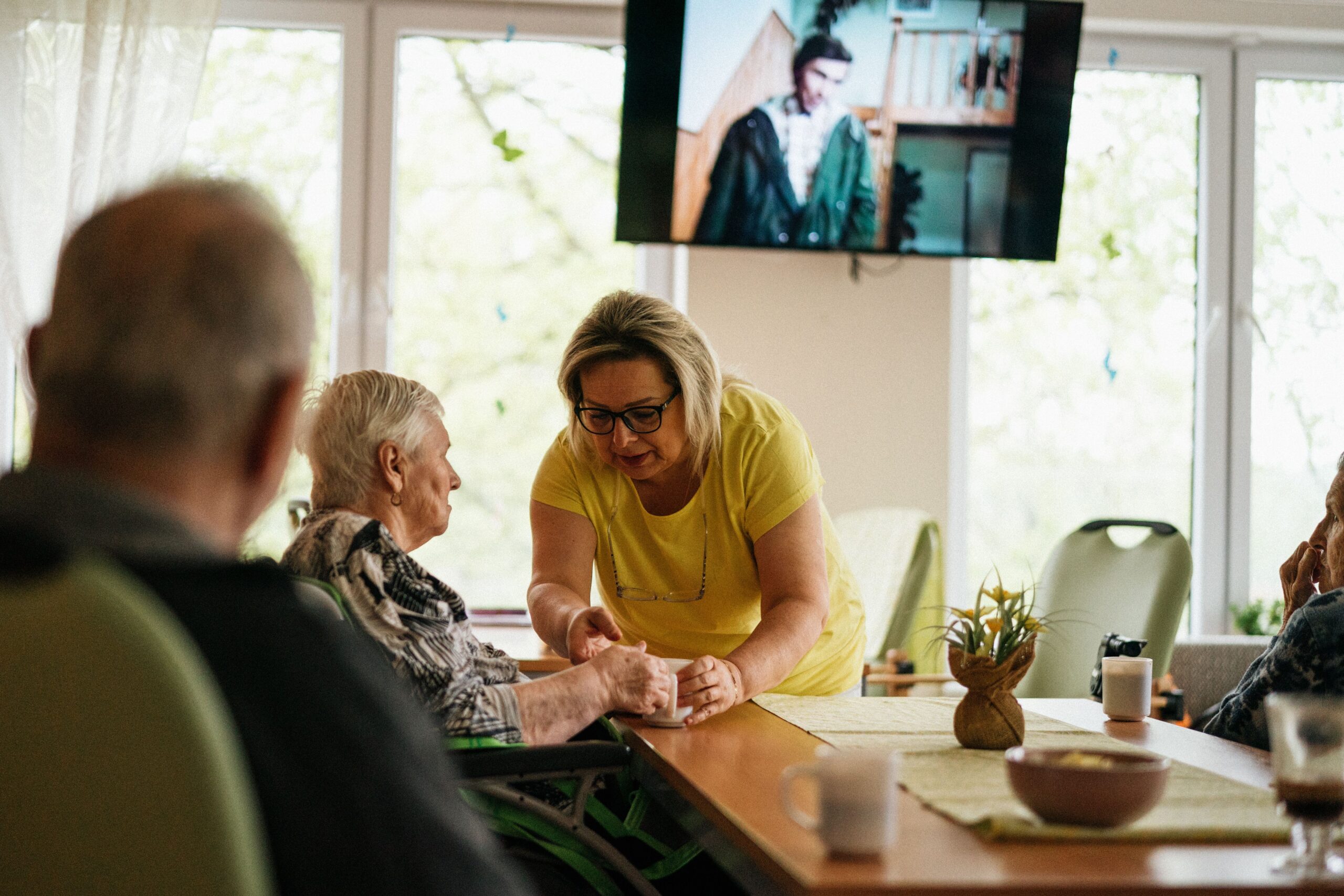 Support worker laughing with an older woman in Camberwell