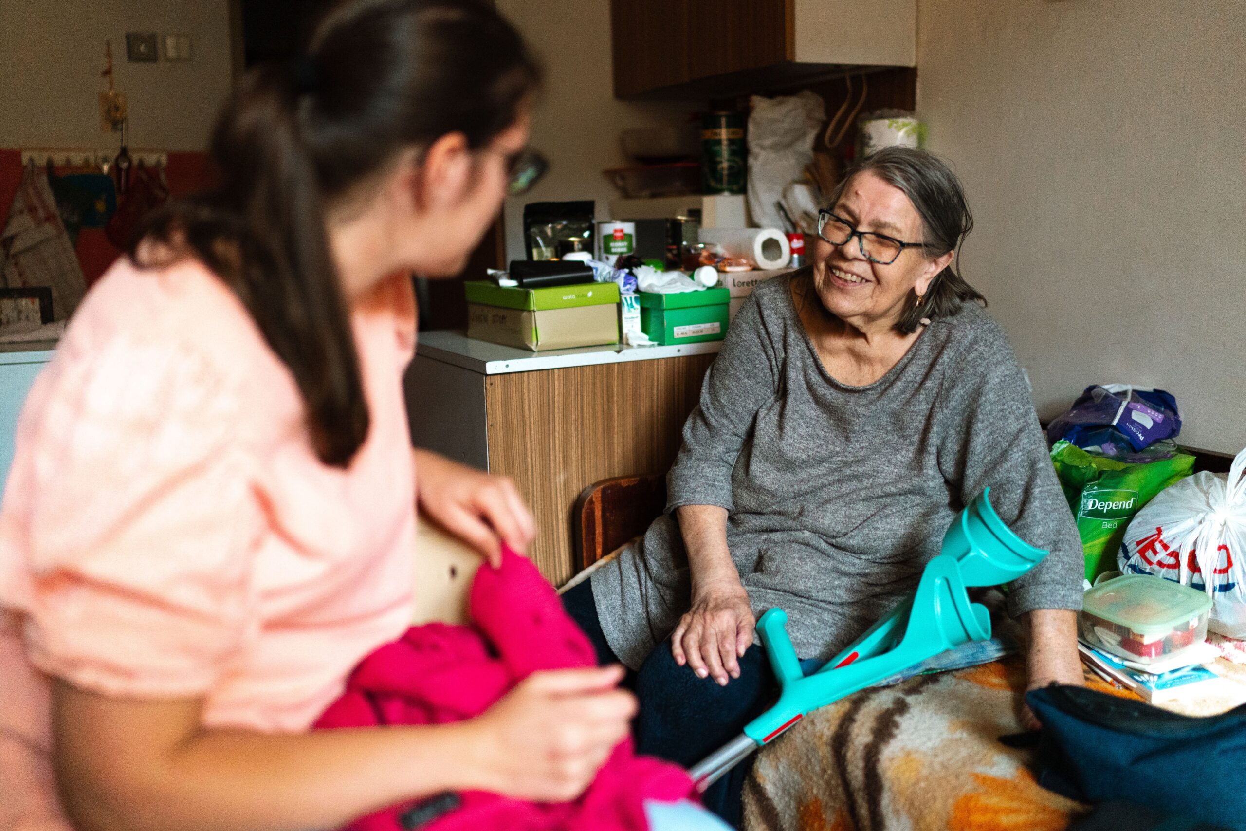 Support worker holding hands with an older woman in Doncaster